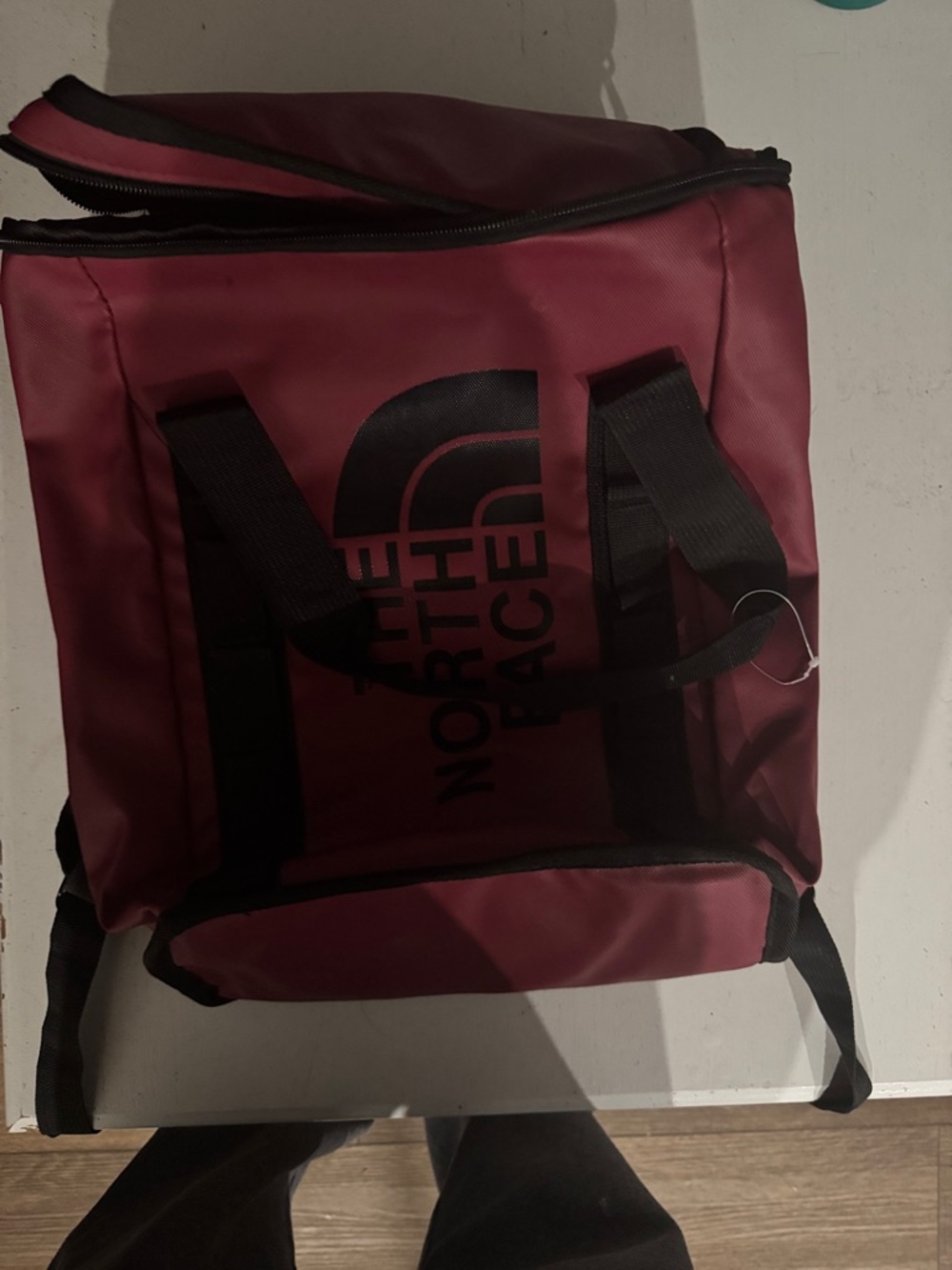 The North Face Burgundy Duffel Bag with Black Accents